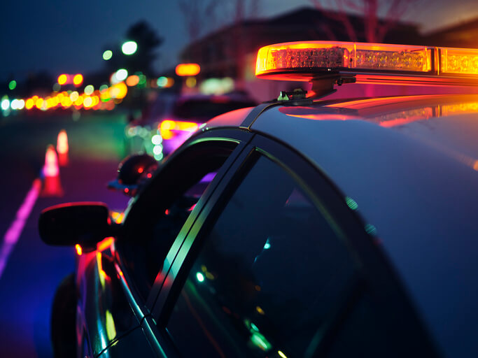 Cop car at night