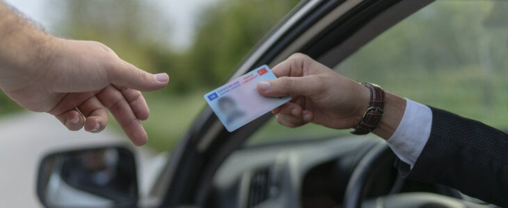 Crime: Policeman gives driver a traffic ticket.