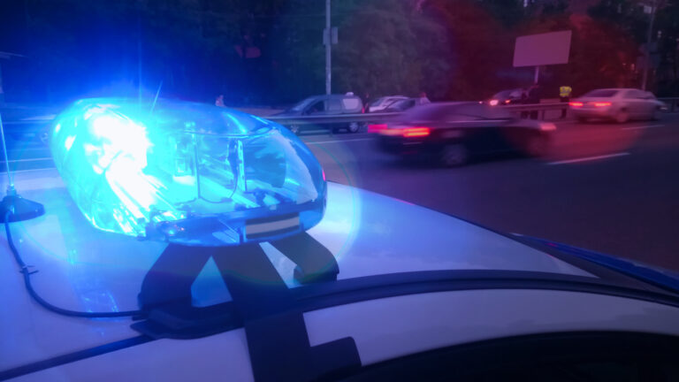 Cop car with flashing lights