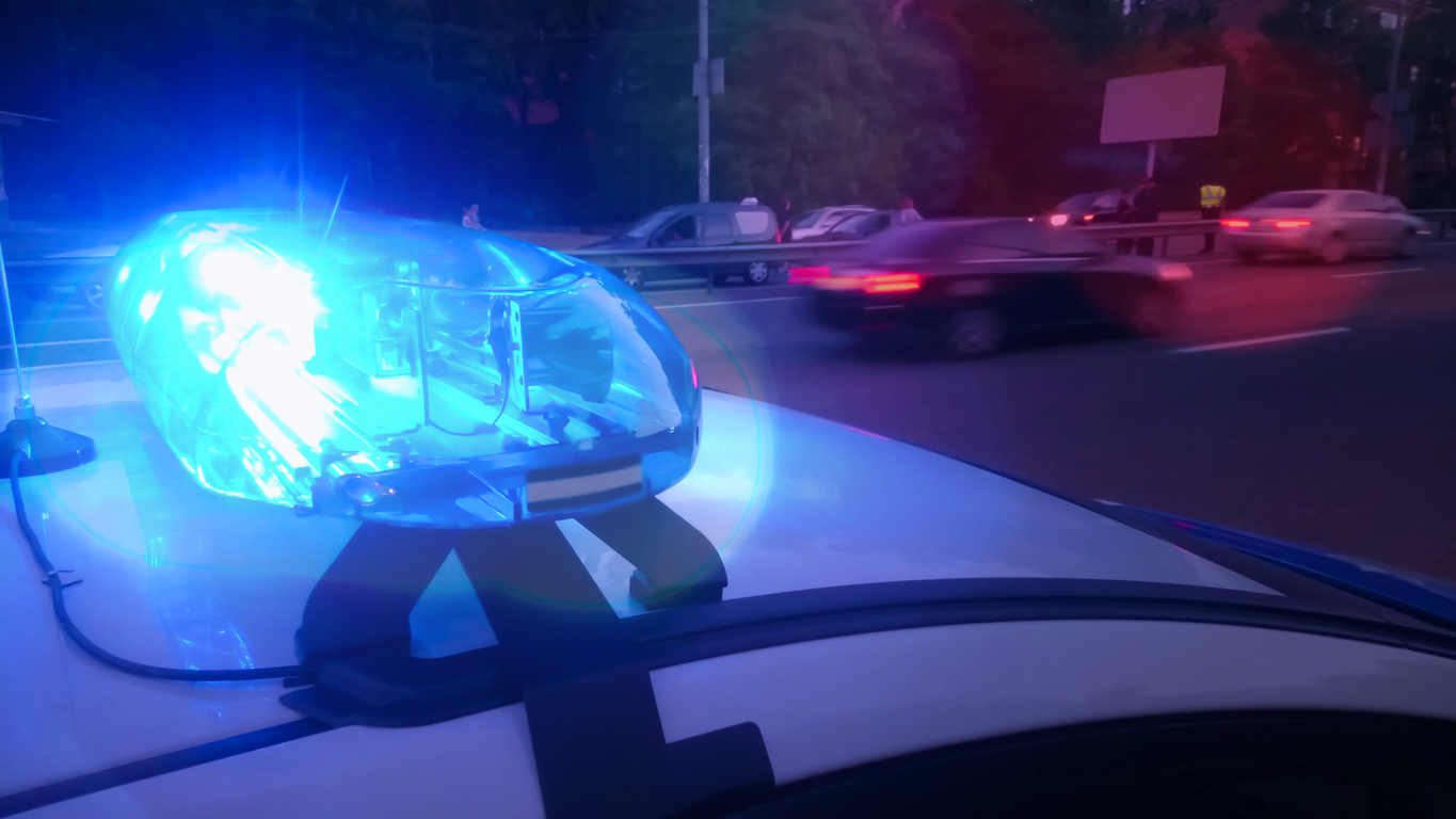 Cop car with flashing lights