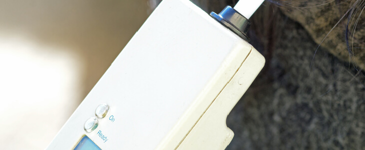 woman blowing into breathalyzer test