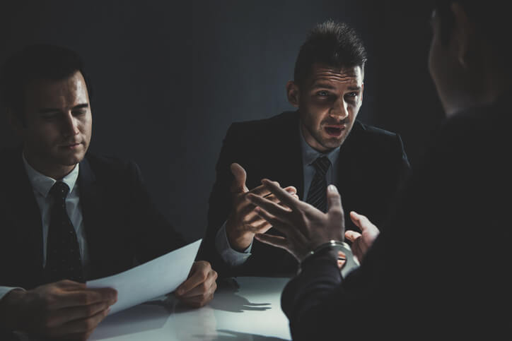 Man sitting with criminal defense attorney