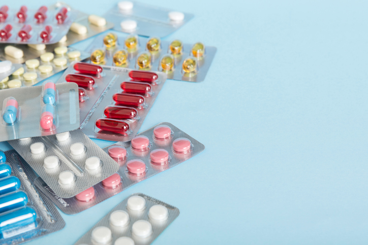 too many different pill of various blisters with different pills Medicines storage at home concept Medication storing. A pile of medicine in blister packs. Pharmaceutical blister packs.