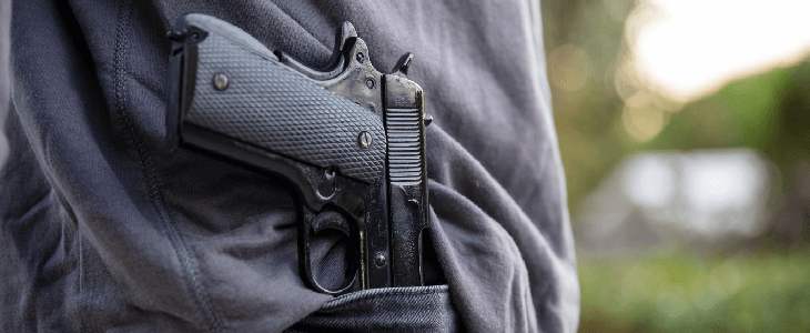 person with gun on their holster, committing a weapon charge offense